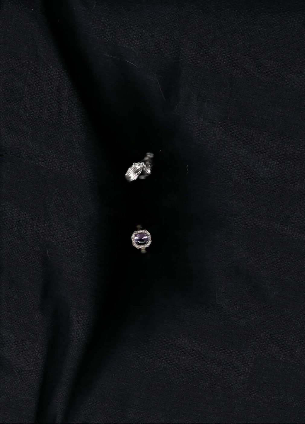 Rings on dark fabric
